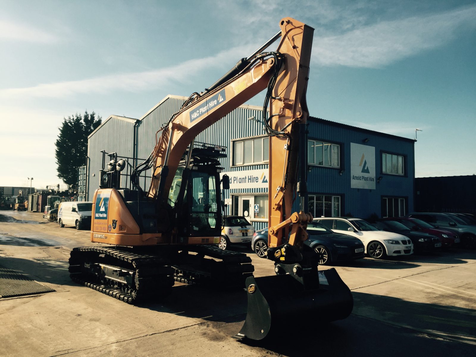 CASE tracked excavator with its bucket lowered outside the H&C office