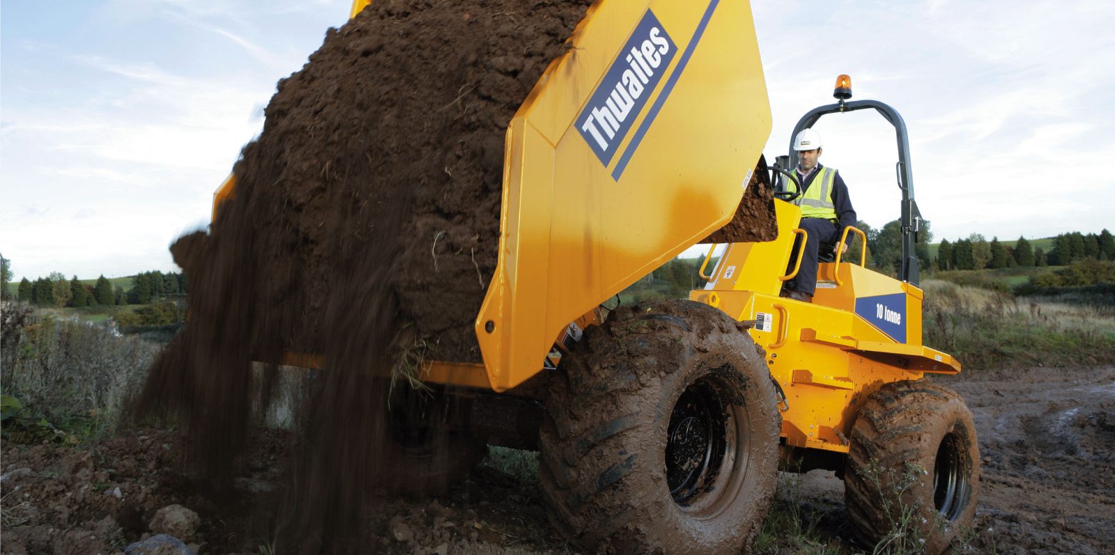Site dumper tipping a load of soil